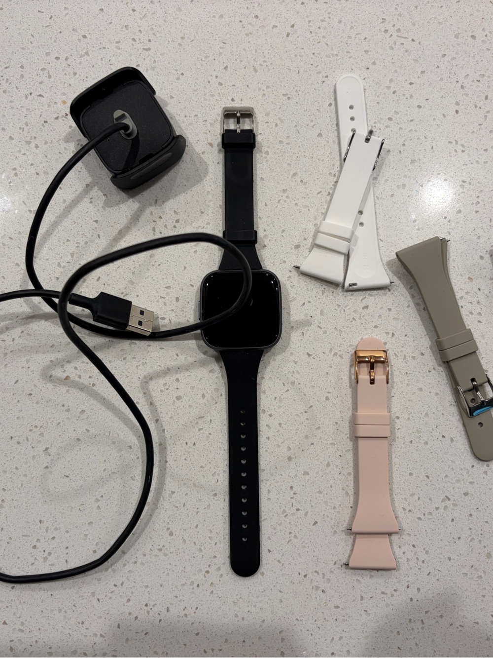 Fitbit versa 2 watch with charging cable and four extra straps
